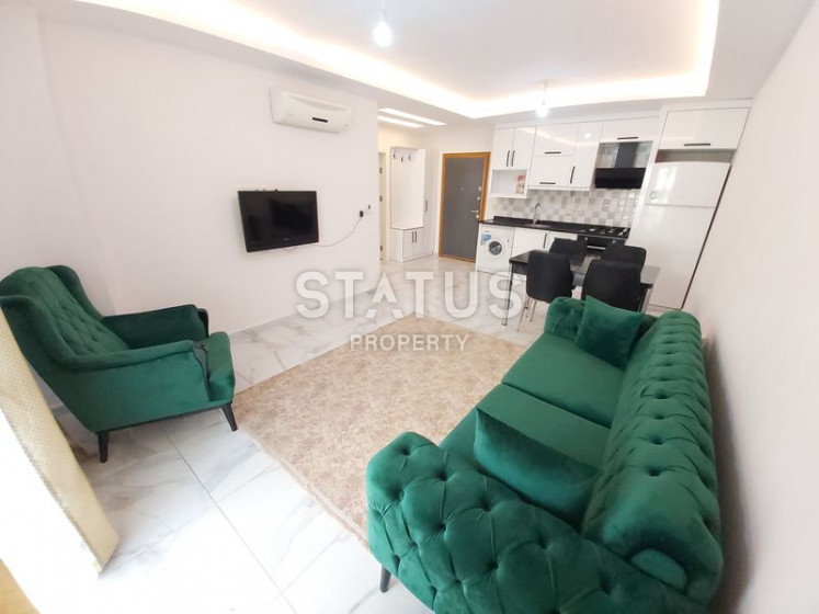 Меблированная квартира 1+1, 65 м2 в центре Махмутлара, 200 метров от пляжа. фото 1