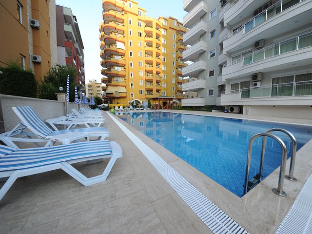 Квартира 2+1 и пентхаус 4+1 с видом на море и крепость в Махмутларе. фото 2