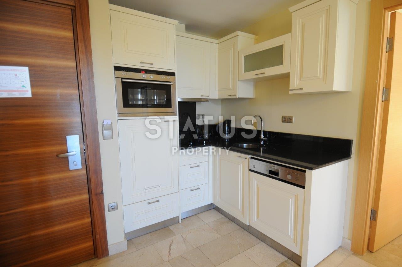 Furnished apartments in a calm and beautiful area of Kargicak with a sea view фото 3