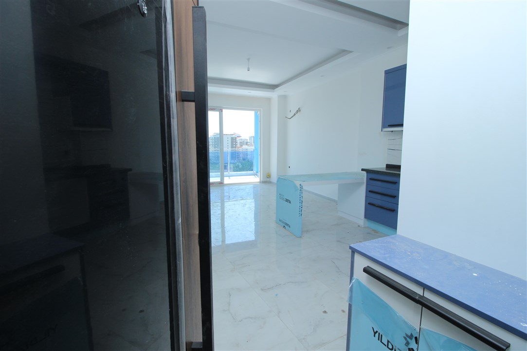 Квартира 1+1, в 500 метрах от моря в новом доме Махмутлар, 60 кв.м. фото 9