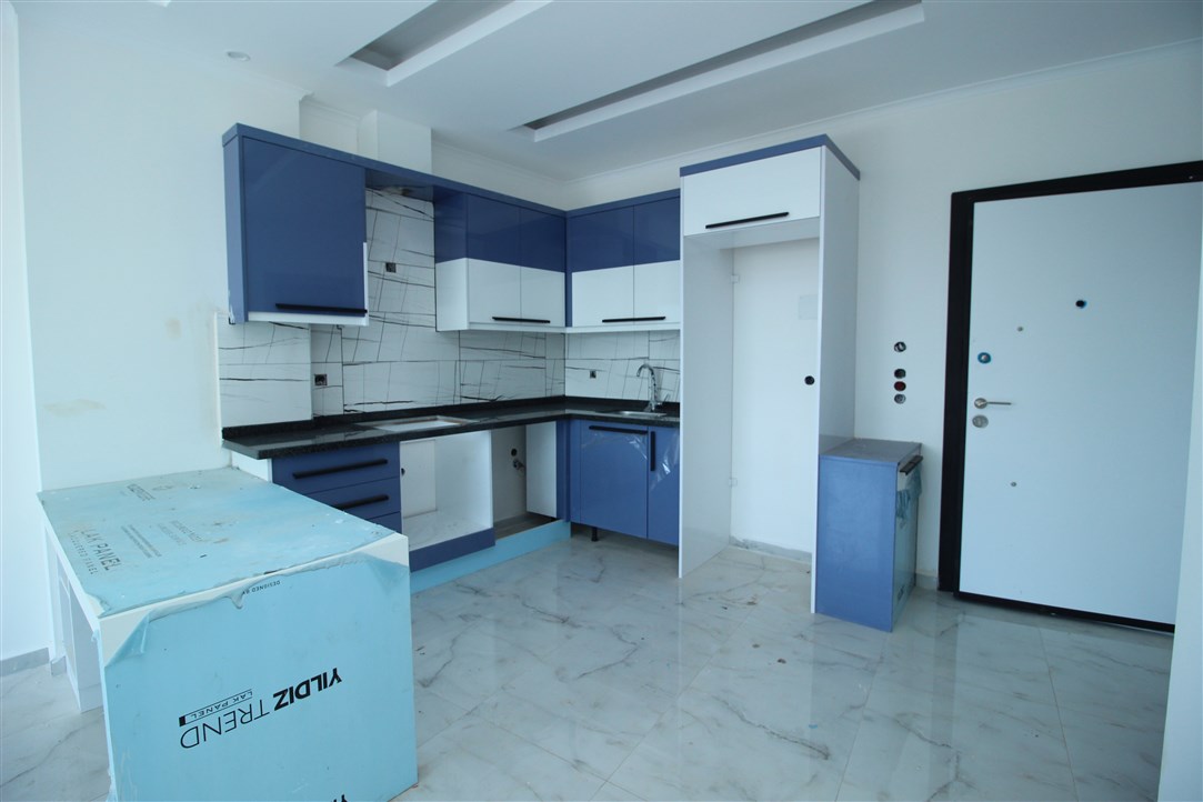 Квартира 1+1, в 500 метрах от моря в новом доме Махмутлар, 60 кв.м. фото 11