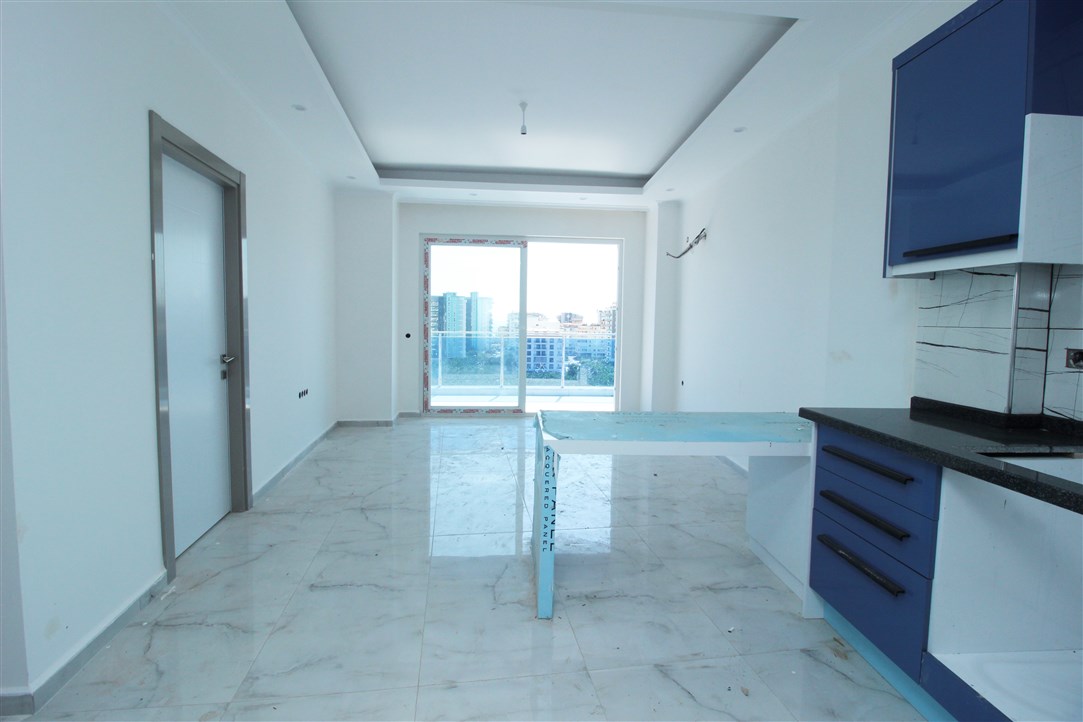 Квартира 1+1, в 500 метрах от моря в новом доме Махмутлар, 60 кв.м. фото 12