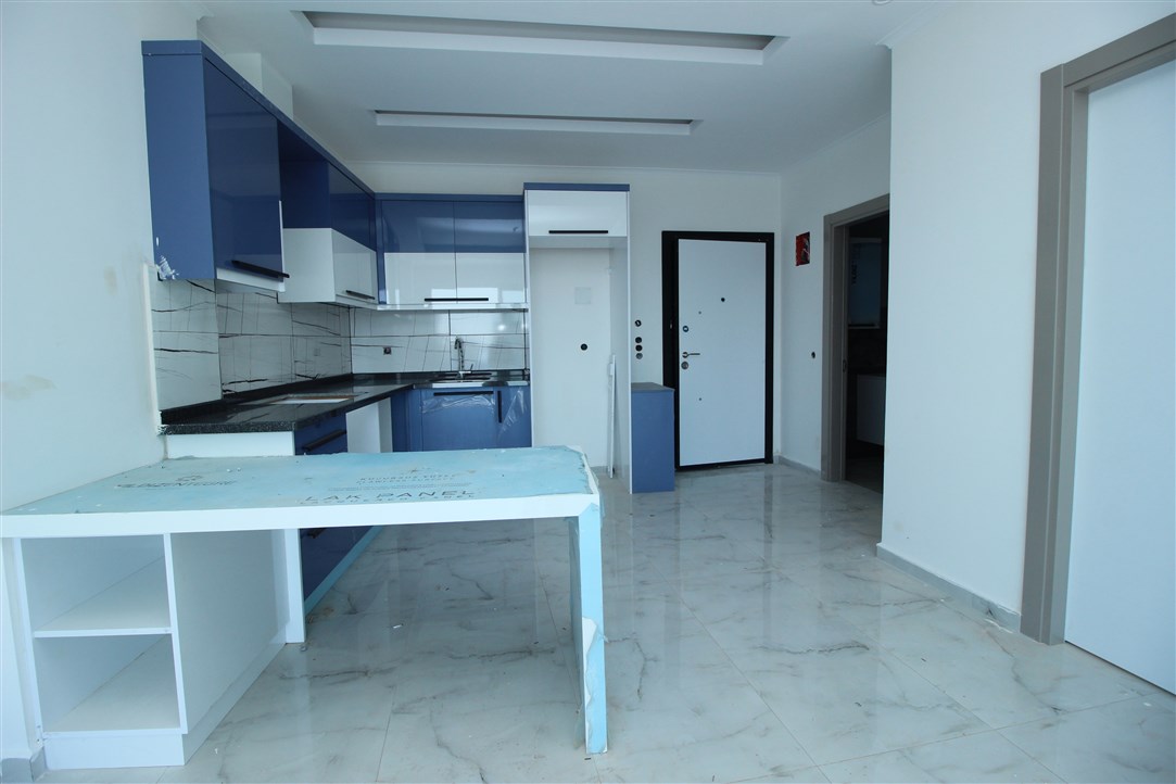 Квартира 1+1, в 500 метрах от моря в новом доме Махмутлар, 60 кв.м. фото 13