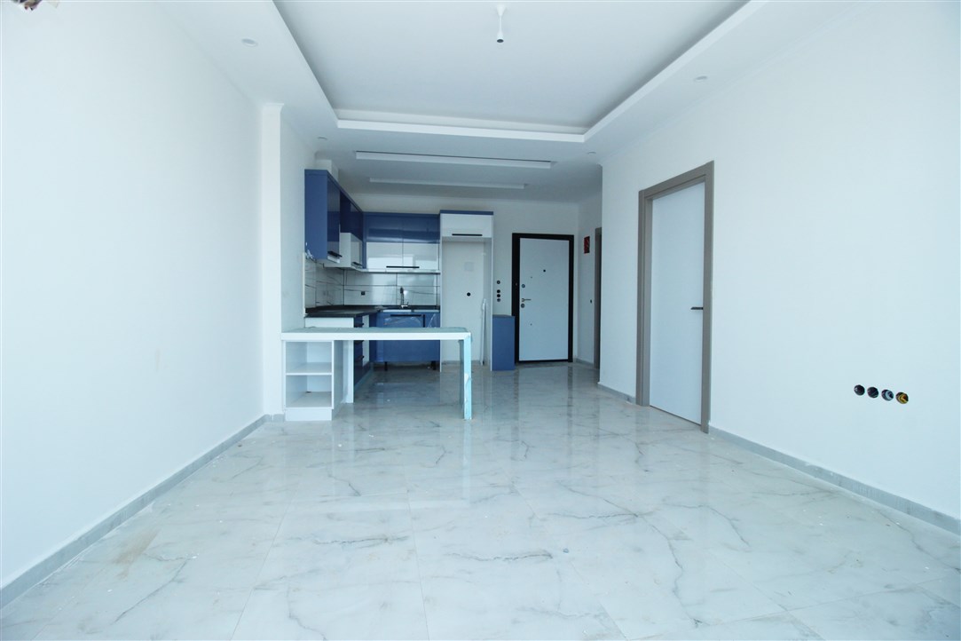 Квартира 1+1, в 500 метрах от моря в новом доме Махмутлар, 60 кв.м. фото 14