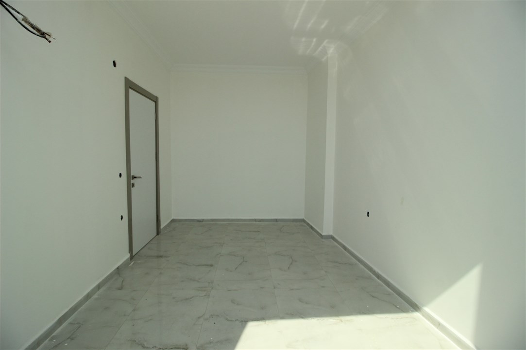 Квартира 1+1, в 500 метрах от моря в новом доме Махмутлар, 60 кв.м. фото 16