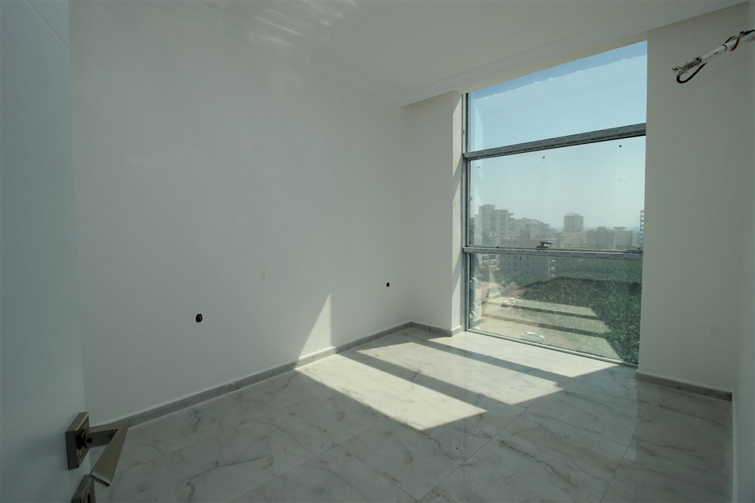 Квартира 1+1, в 500 метрах от моря в новом доме Махмутлар, 60 кв.м. фото 17