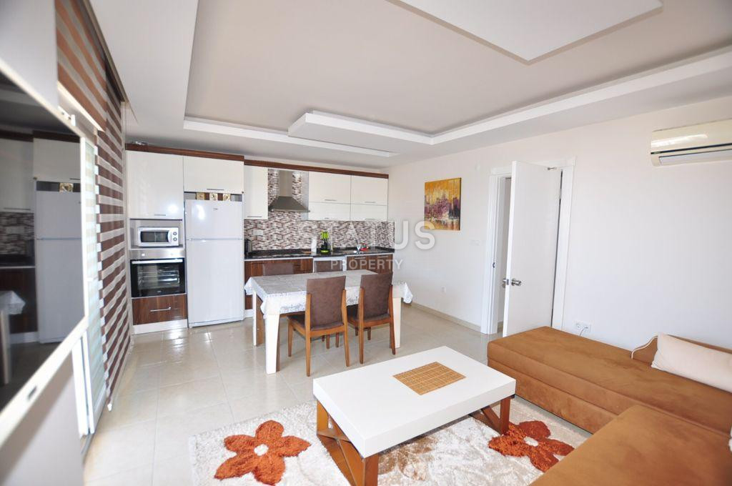 Spacious furnished apartment 1+1 with sea view, 70 m2. Mahmutlar, Alanya. фото 12