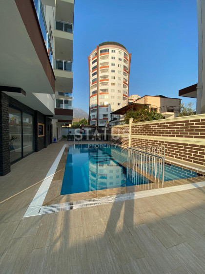 Квартира 1+1 в новом комплексе в Махмутларе, 56 кв.м. фото 1