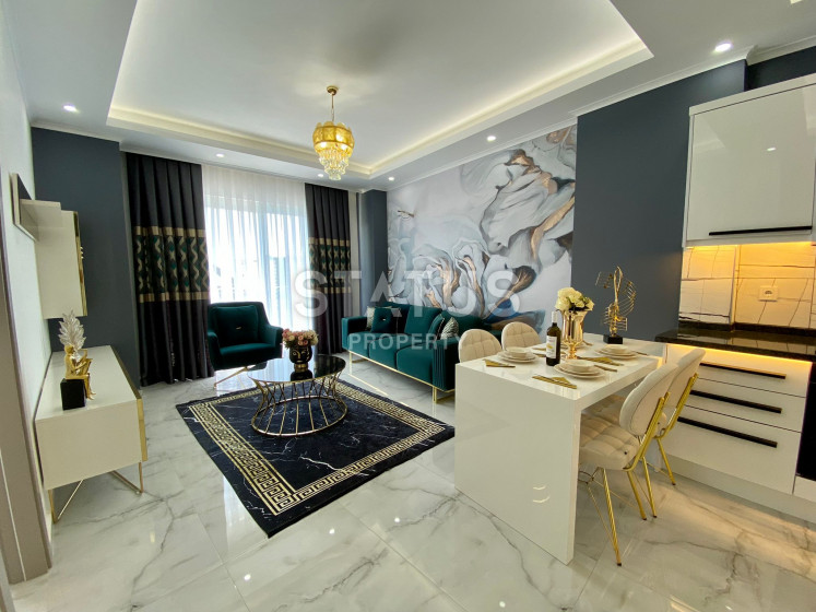 Меблированные апартаменты 1+1 в новом доме. Махмутлар, 65м2. фото 1