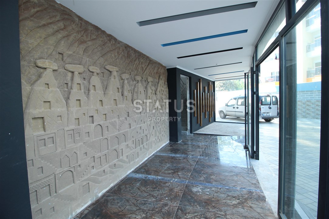 Furnished apartments 1+1 in a new house. Mahmutlar, 65m2. фото 6