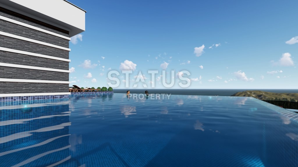 Новый инвестиционный проект повышенного комфорта с инфинити бассейном на крыше в районе Махмутлар 65-135 кв.м. фото 6