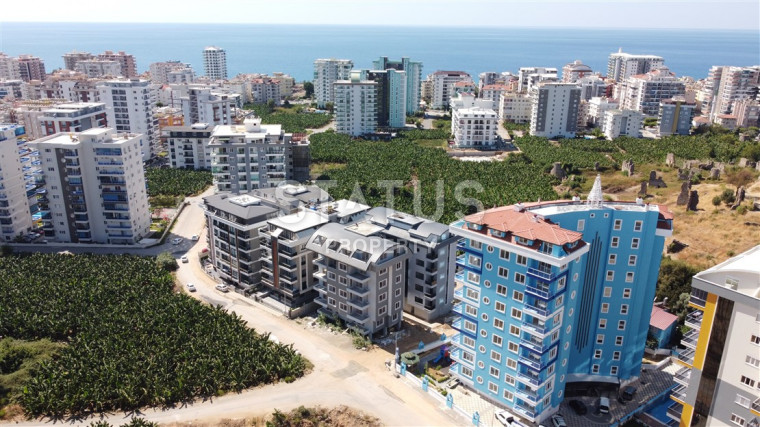 Квартира 1+1 с видом на Наулу в новом комплексе в Махмутларе, 55 м2. фото 1