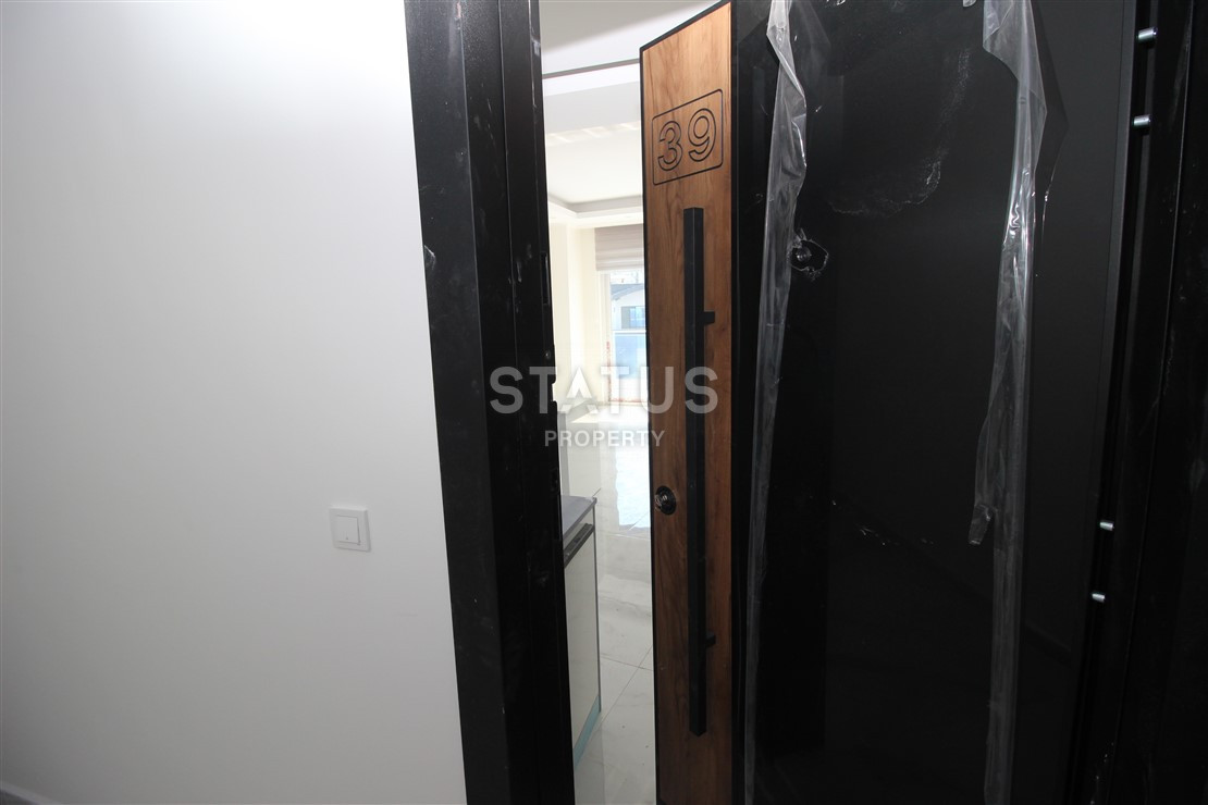 Квартира 1+1 с видом на Наулу в новом комплексе в Махмутларе, 55 м2. фото 3