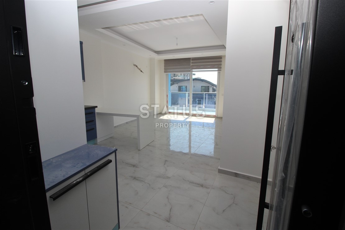 Квартира 1+1 с видом на Наулу в новом комплексе в Махмутларе, 55 м2. фото 4