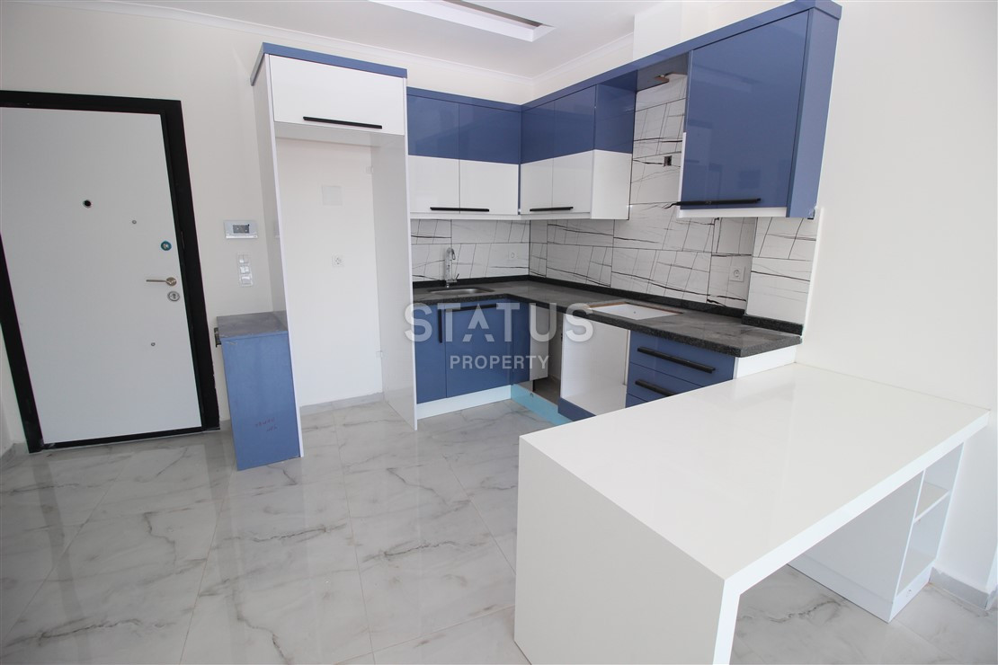 Квартира 1+1 с видом на Наулу в новом комплексе в Махмутларе, 55 м2. фото 7