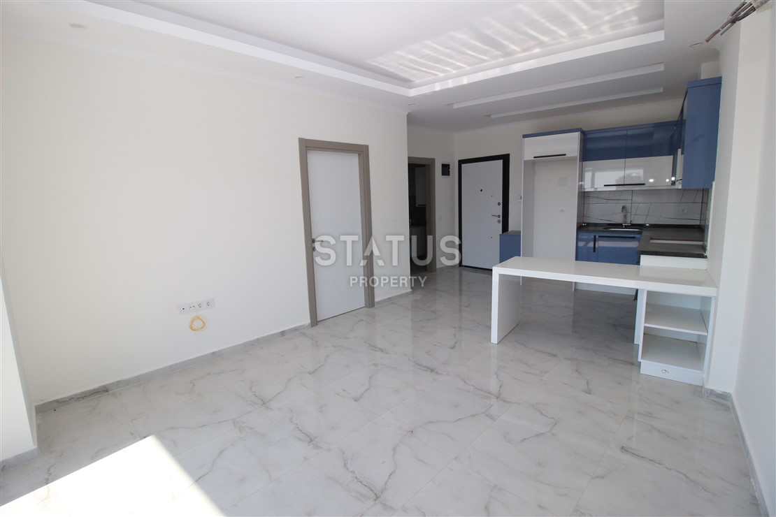 Квартира 1+1 с видом на Наулу в новом комплексе в Махмутларе, 55 м2. фото 8