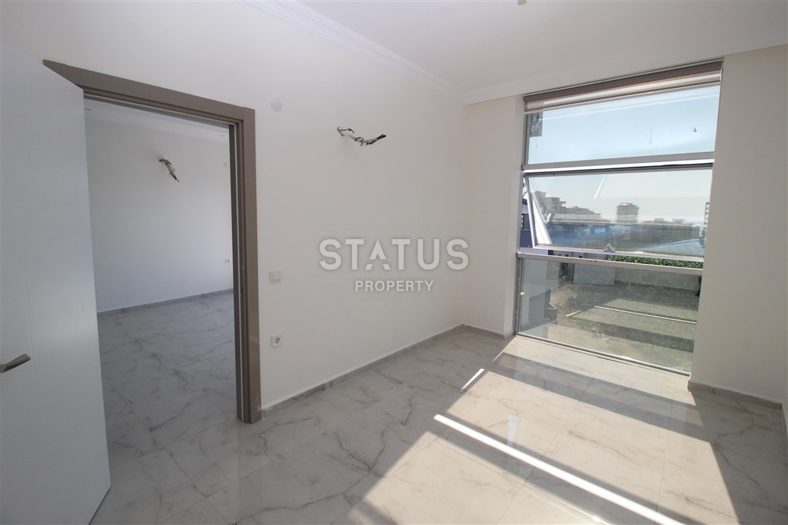 Квартира 1+1 с видом на Наулу в новом комплексе в Махмутларе, 55 м2. фото 9