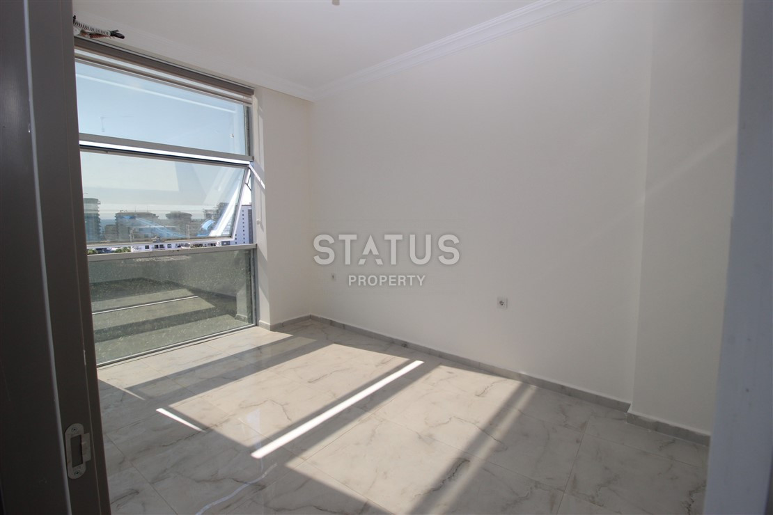 Квартира 1+1 с видом на Наулу в новом комплексе в Махмутларе, 55 м2. фото 10