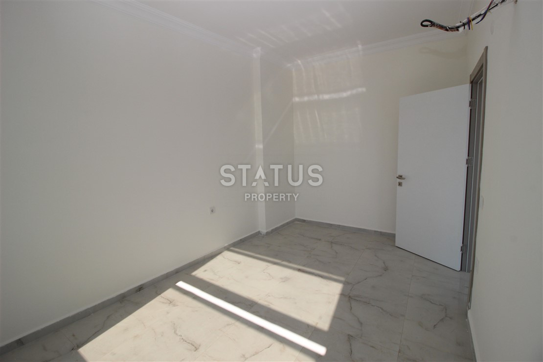 Квартира 1+1 с видом на Наулу в новом комплексе в Махмутларе, 55 м2. фото 11