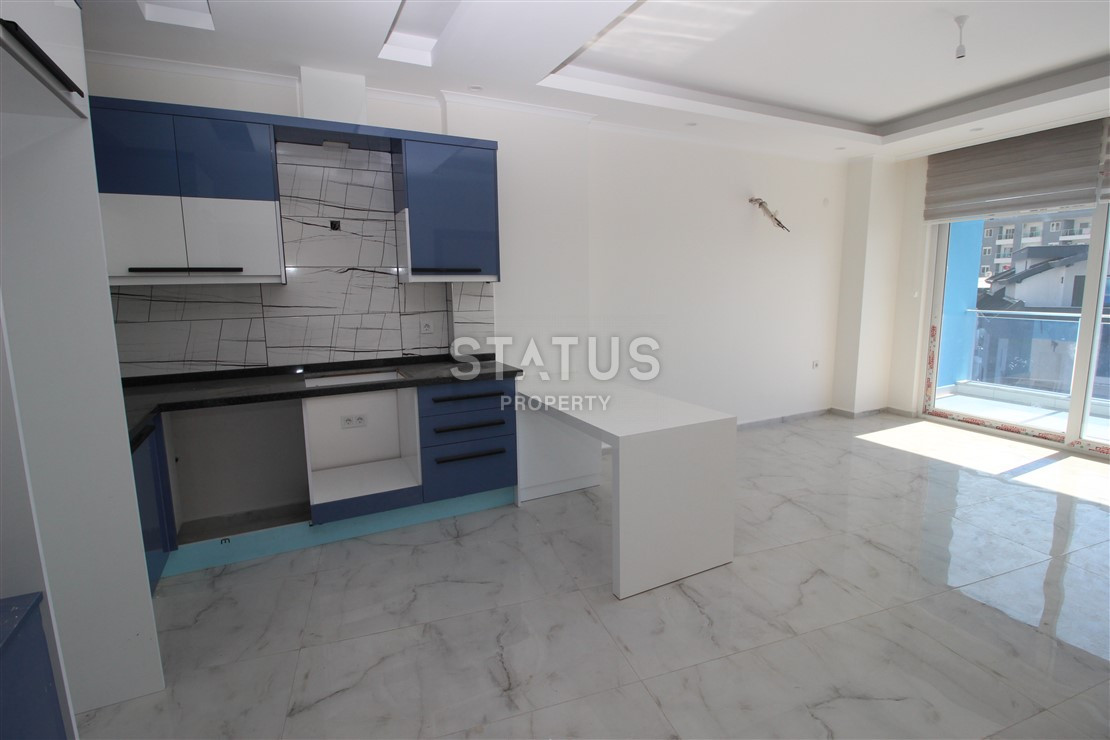 Квартира 1+1 с видом на Наулу в новом комплексе в Махмутларе, 55 м2. фото 12