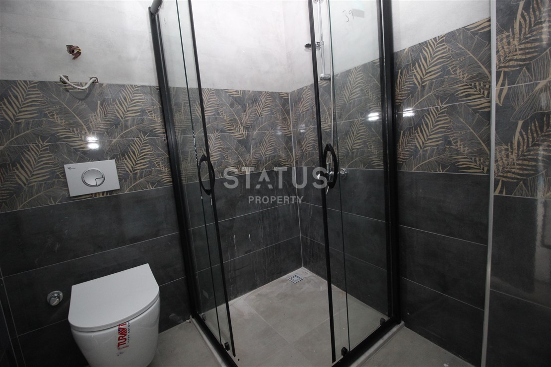 Квартира 1+1 с видом на Наулу в новом комплексе в Махмутларе, 55 м2. фото 13