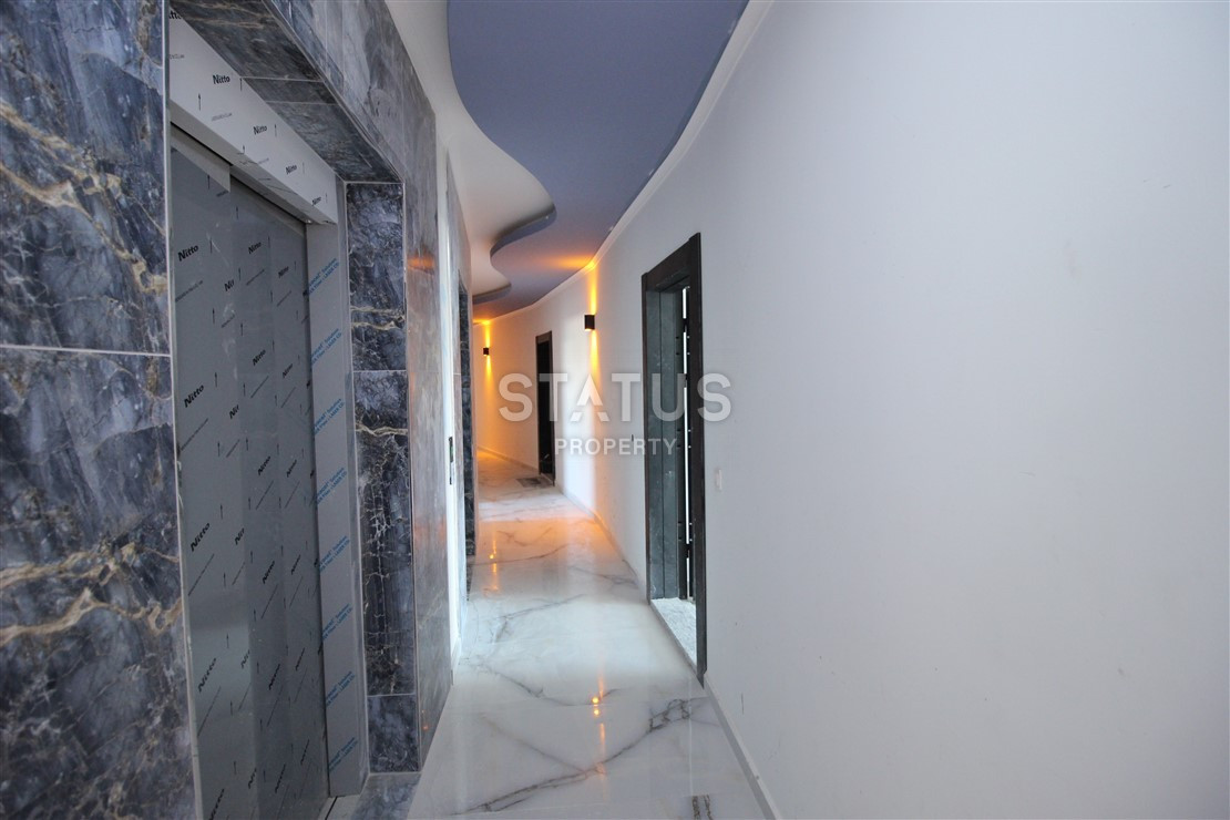 Квартира 1+1 с видом на Наулу в новом комплексе в Махмутларе, 55 м2. фото 14