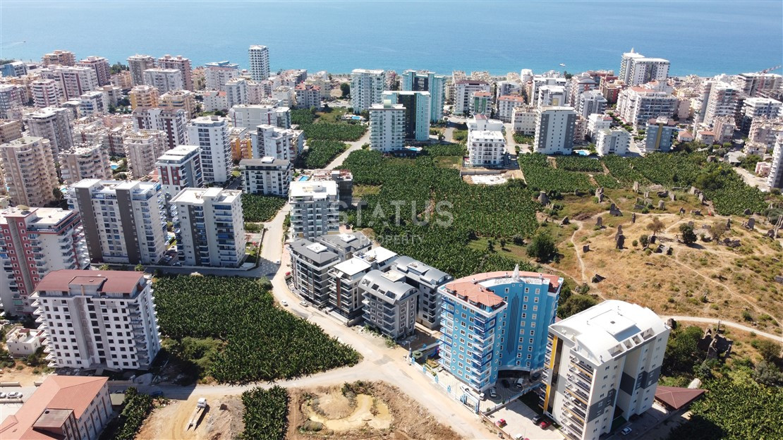 Квартира 1+1 с видом на Наулу в новом комплексе в Махмутларе, 55 м2. фото 21