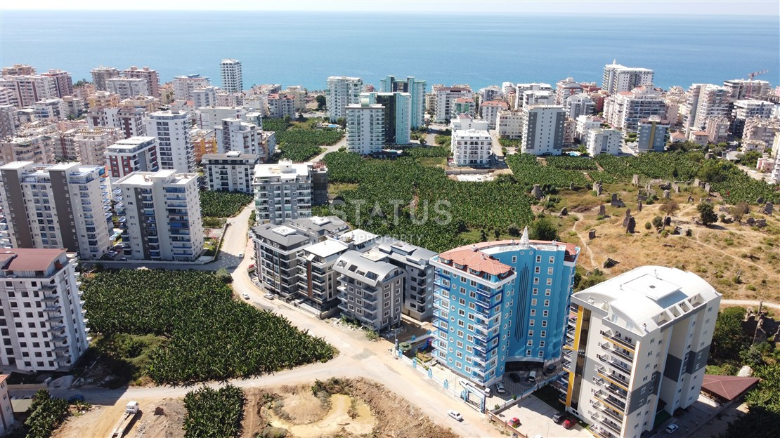 Квартира 1+1 с видом на Наулу в новом комплексе в Махмутларе, 55 м2. фото 22