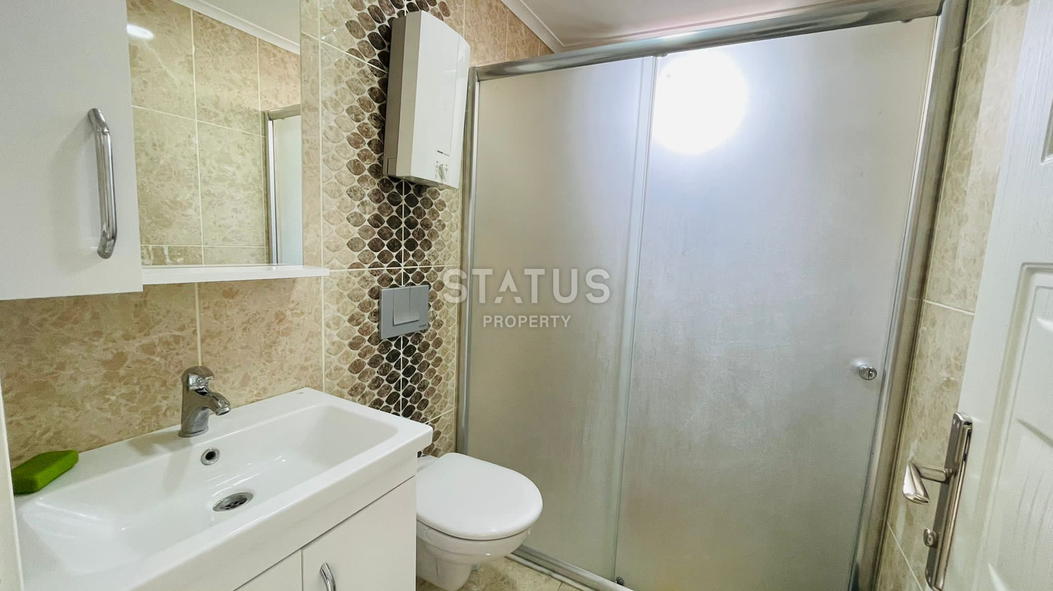 Меблированная двухкомнатная квартира в новом доме в центре Махмутлара, 55 кв.м. фото 7