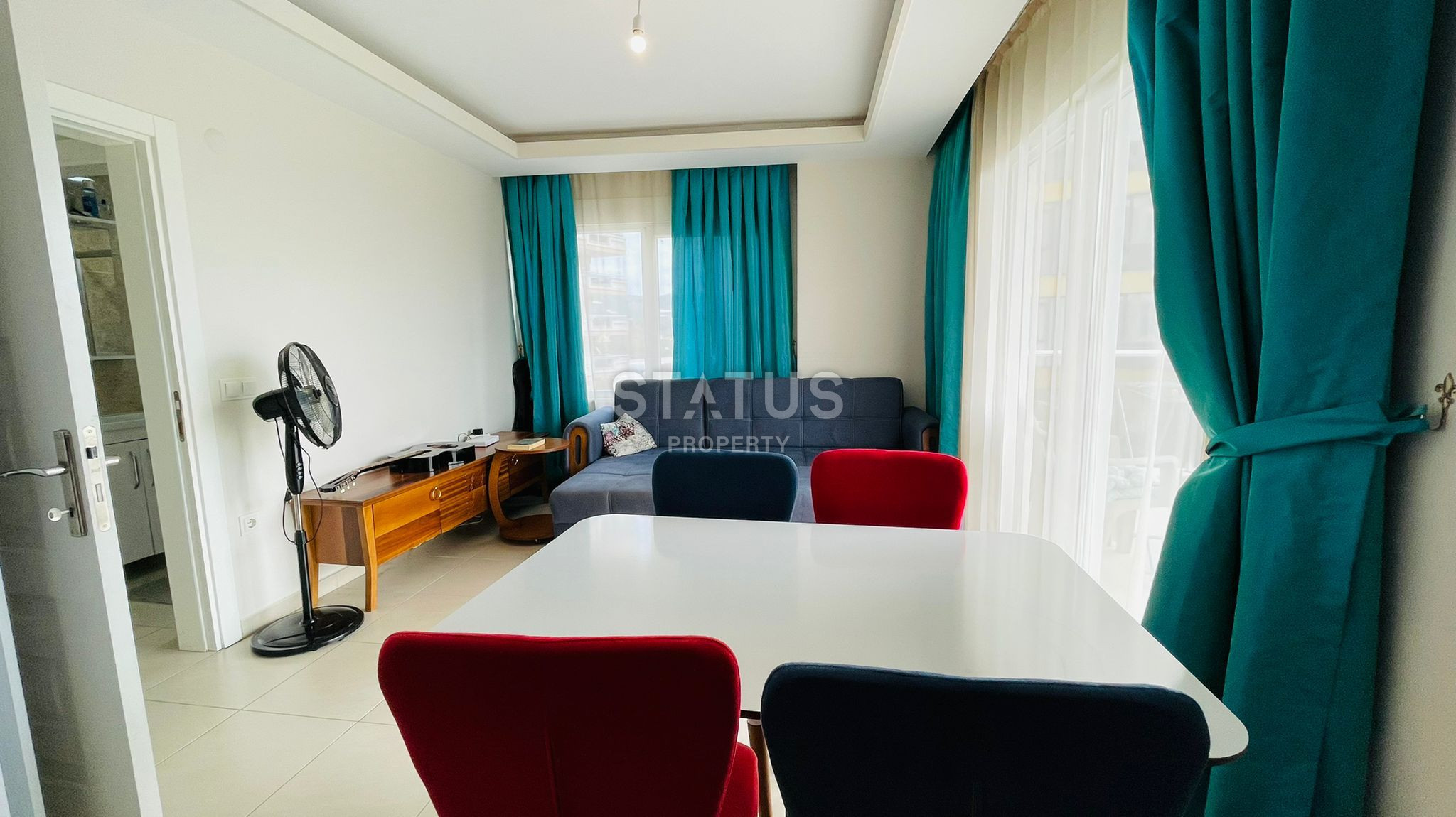 Меблированная двухкомнатная квартира в новом доме в центре Махмутлара, 55 кв.м. фото 12