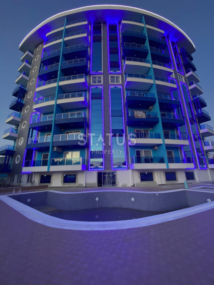 Двухкомнатная квартира в новом комплексе в Махмутларе, в 500 метрах от моря, 55 кв.м. фото 1