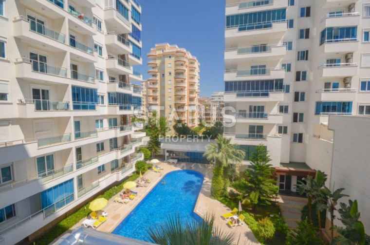 Просторные меблированные апартаменты 2+1 в 150 метрах от моря в Махмутларе. фото 1