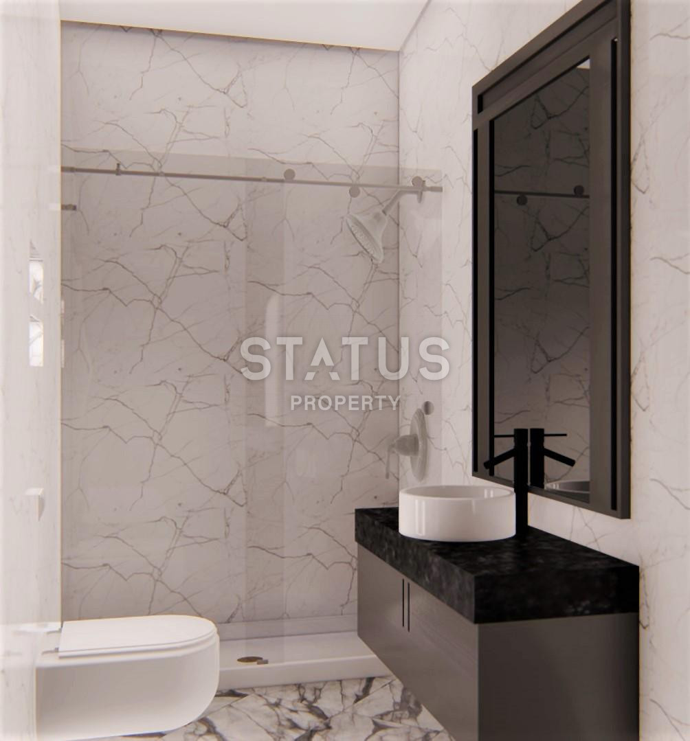 Апартаменты 1+1 и 2+1 от 50 до 138 м2 в новом комплексе у моря в центре Алании. фото 10