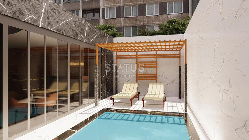 Апартаменты 1+1 и 2+1 от 50 до 138 м2 в новом комплексе у моря в центре Алании. фото 13