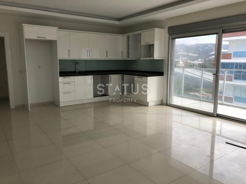 Трехкомнатная квартира без мебели в 600 метрах от моря в Махмутларе, 105м.кв фото 1