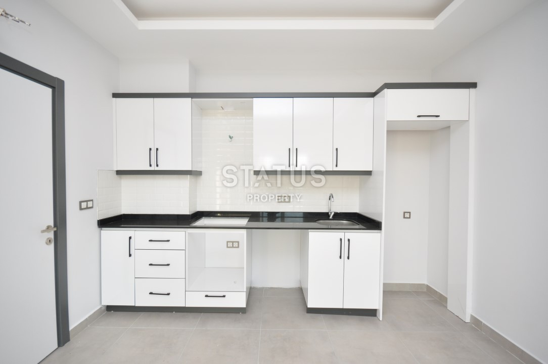 Апартаменты 1+1 в районе Махмутлар, 56 м2 фото 3