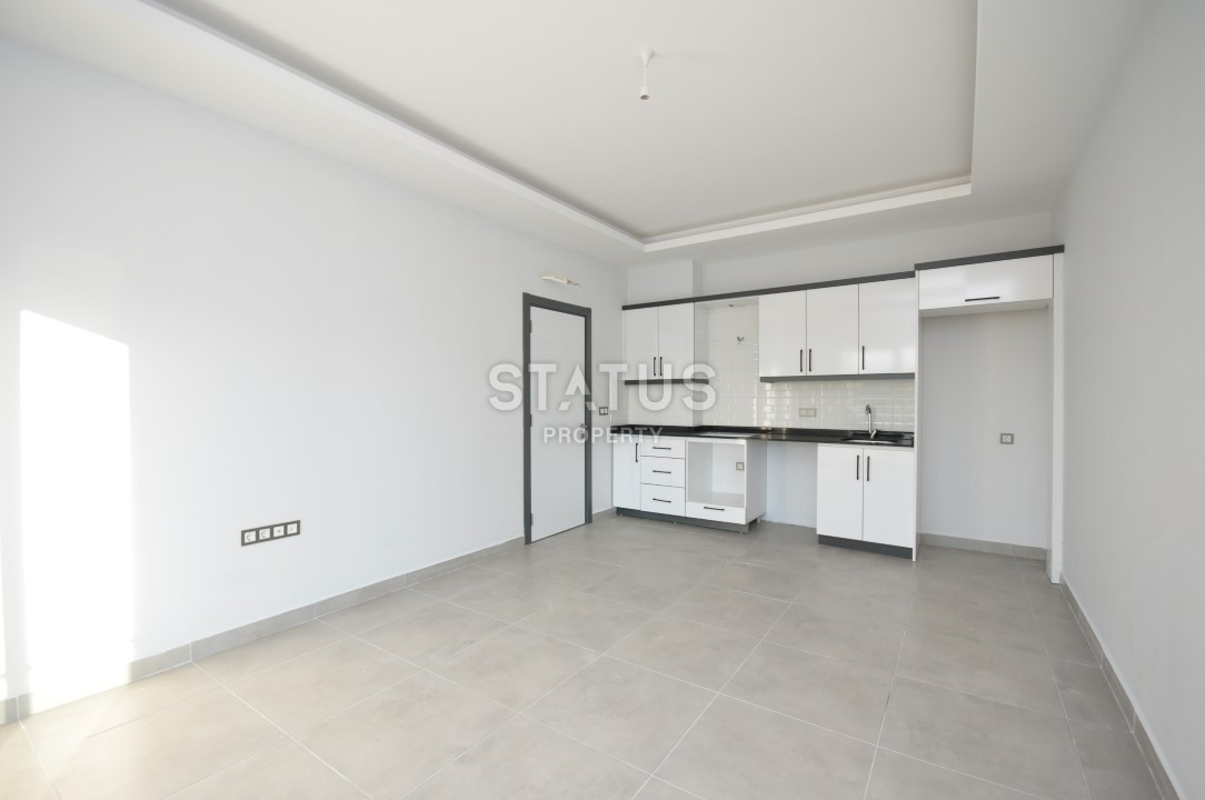 Апартаменты 1+1 в районе Махмутлар, 56 м2 фото 4