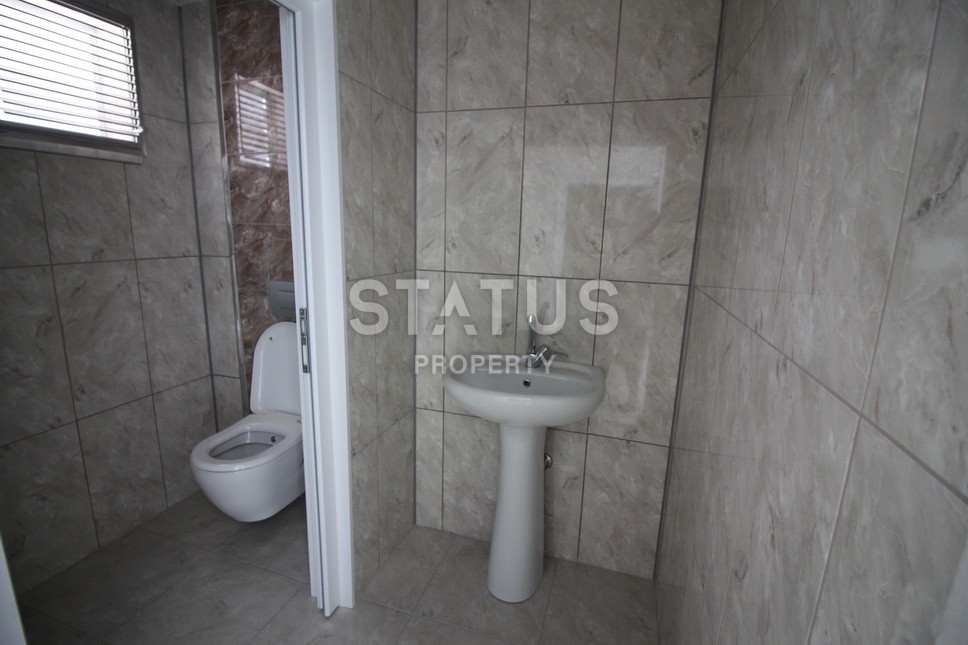 Новые апартаменты  в новом комплексе в самом центре Махмутлара. Большие площади и маленькие цены! 80 кв.м. фото 11