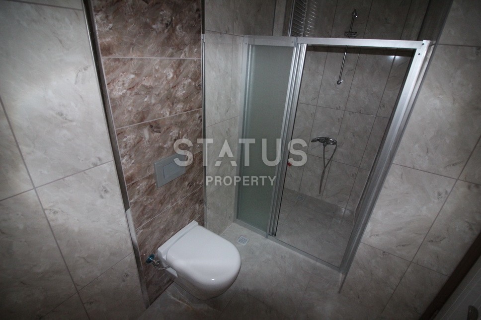 Новые апартаменты  в новом комплексе в самом центре Махмутлара. Большие площади и маленькие цены! 80 кв.м. фото 22