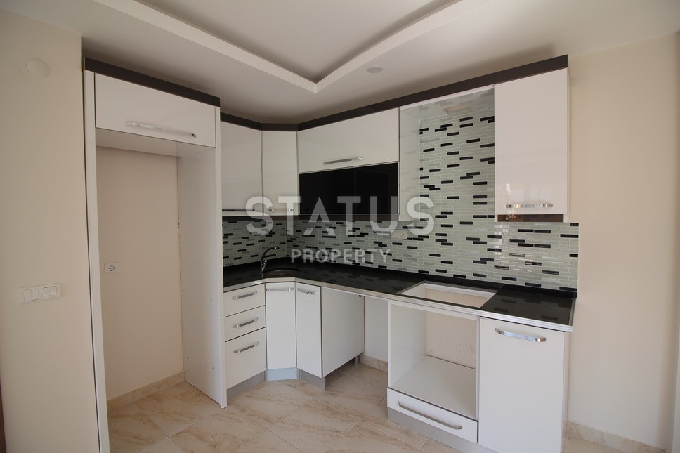 Новые апартаменты  в новом комплексе в самом центре Махмутлара. Большие площади и маленькие цены! 80 кв.м. фото 25