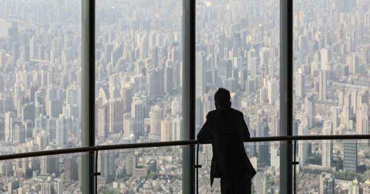 China lifts 13-year freeze on multiple home ownership to revive real estate market
