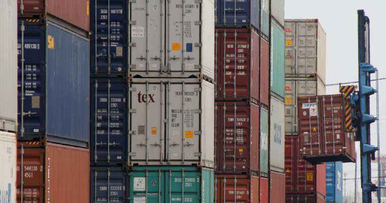 Japan's exports surge on weak Yen, yet business sentiment falters