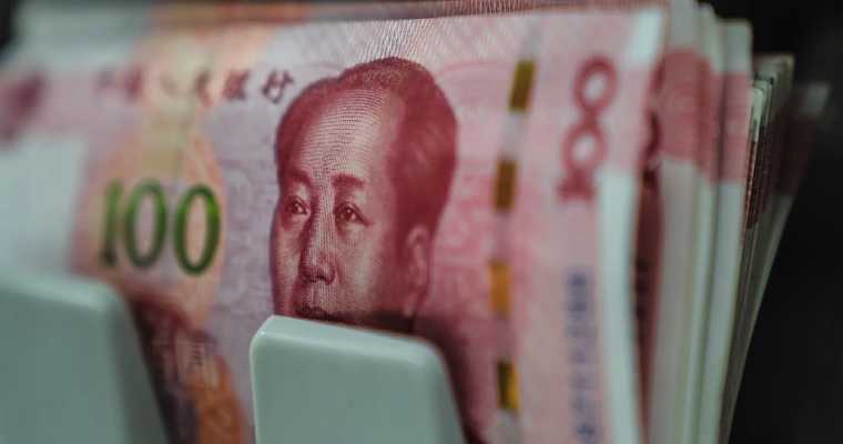 China's central bank cuts key interest rates to historic lows to stimulate economy