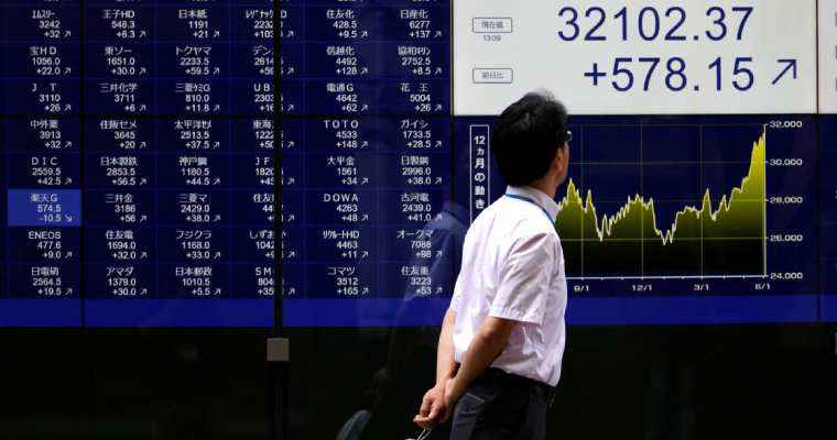 Japan shares peak at 34-year highs as Bank of Japan stands firm