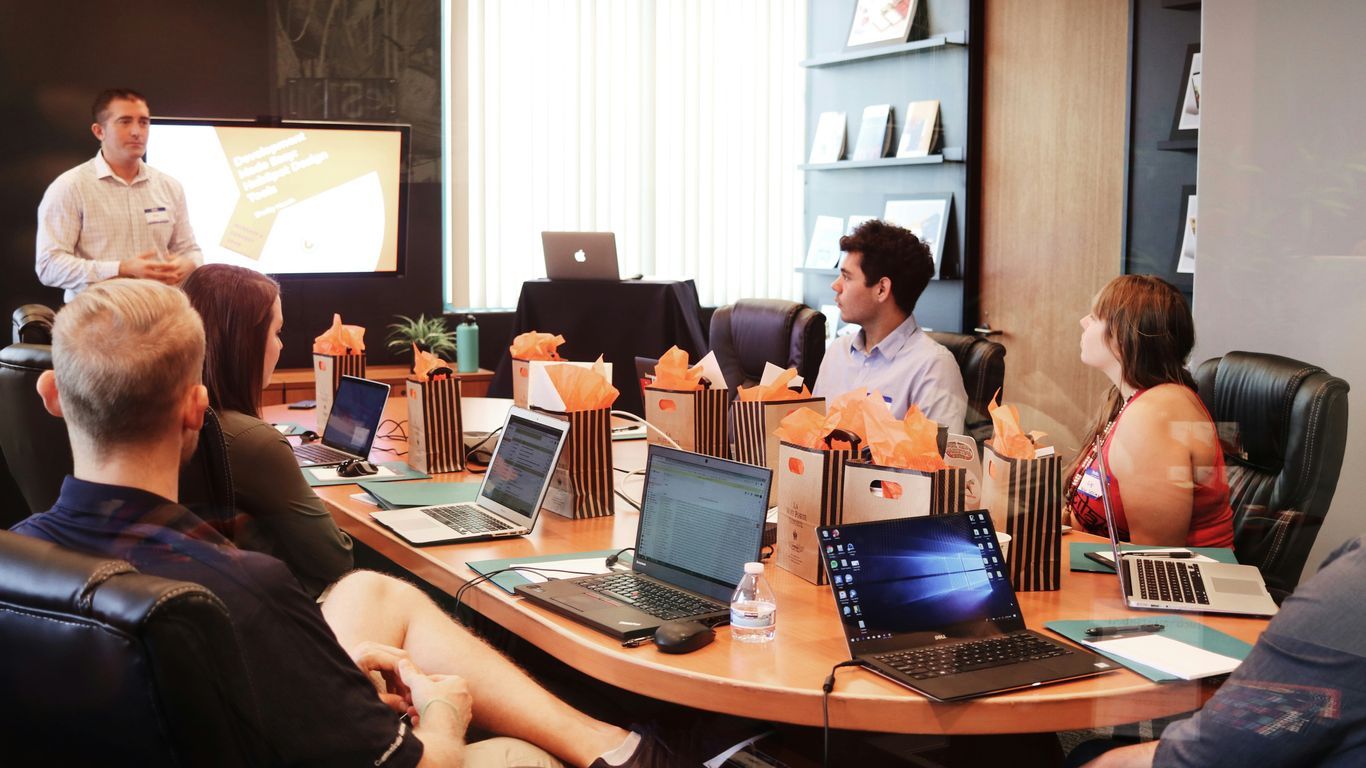 Modern office workers reviewing digital marketing growth metrics