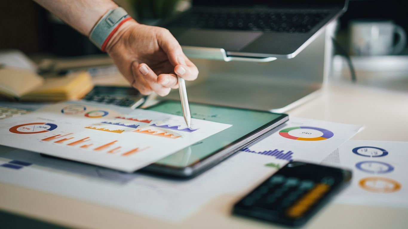 Marketing professionals reviewing digital growth charts
