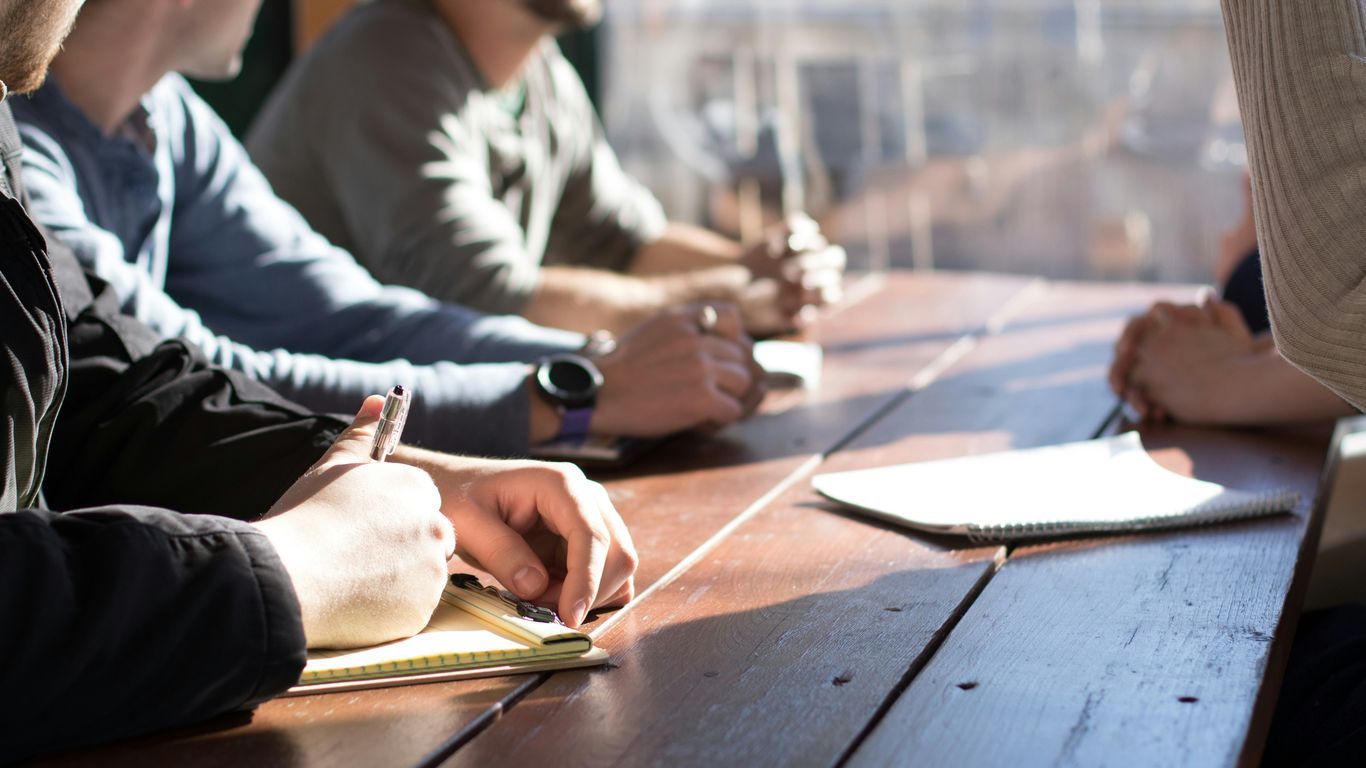 Employees reviewing sustainable business plans
