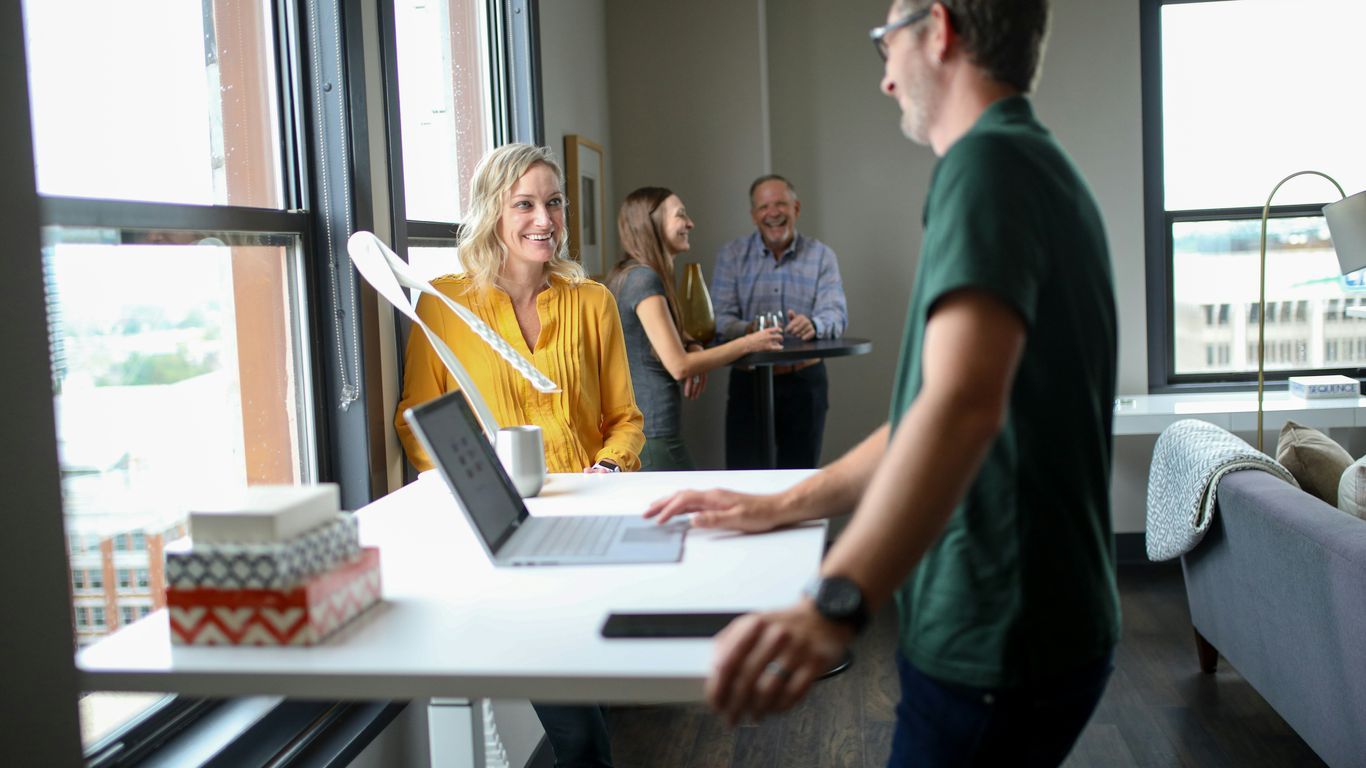A small team collaborating on a digital document interface