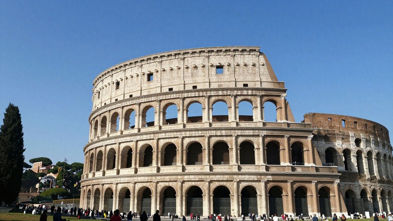 The ancient Colosseum in Rome under a blue sky.