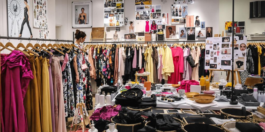 Designers creating luxury fashion in a stylish studio.